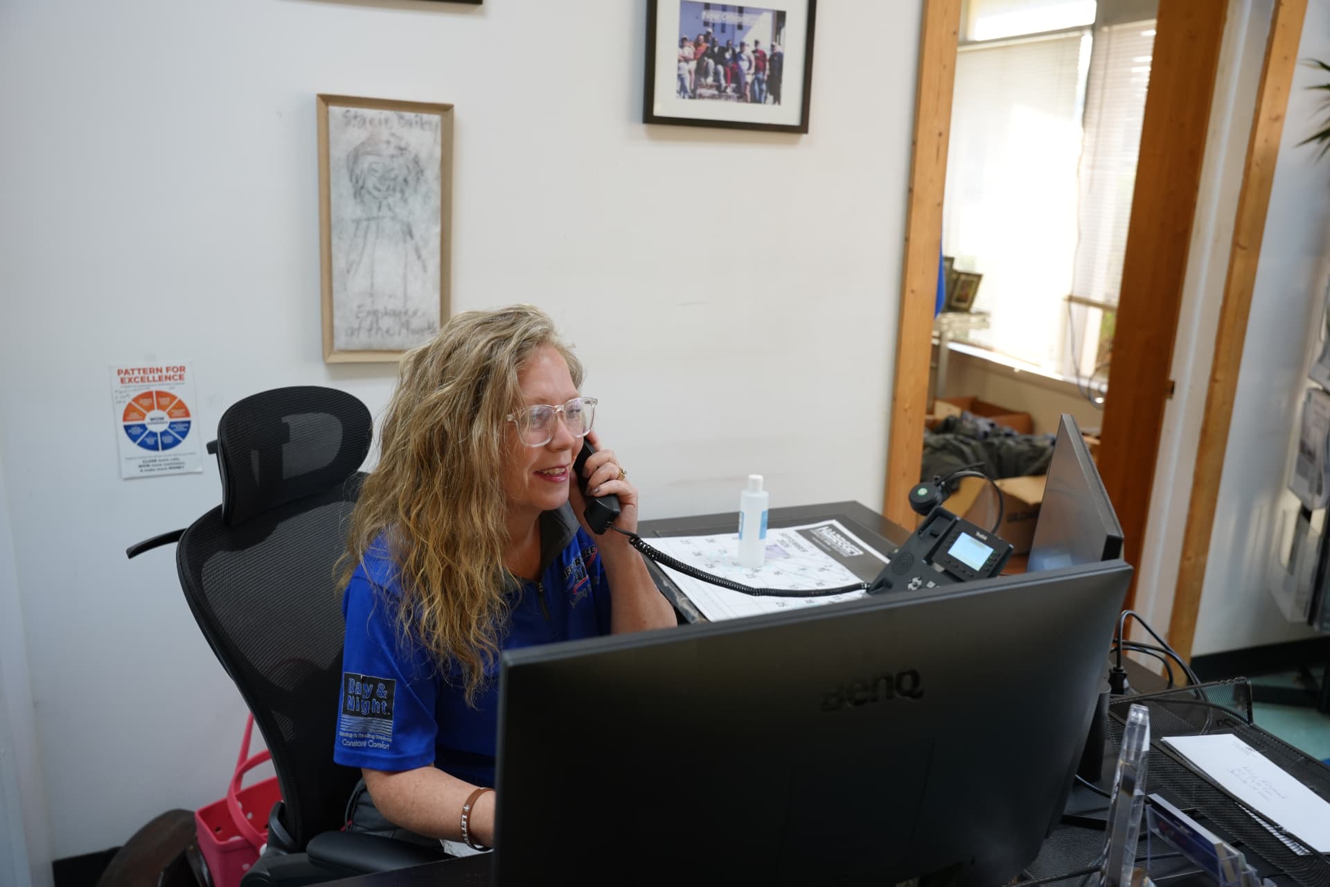 An Affordable Air team member answering a customer call at the front desk in Chillicothe